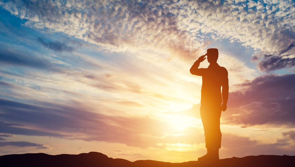 Veteran smiling, looking at Medicare benefits outline