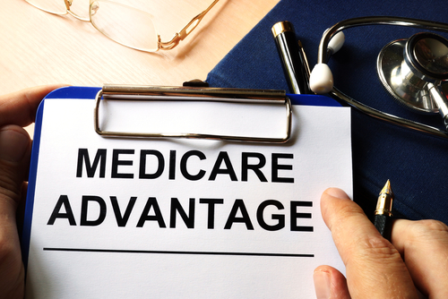 Senior couple looking over Medicare Advantage options